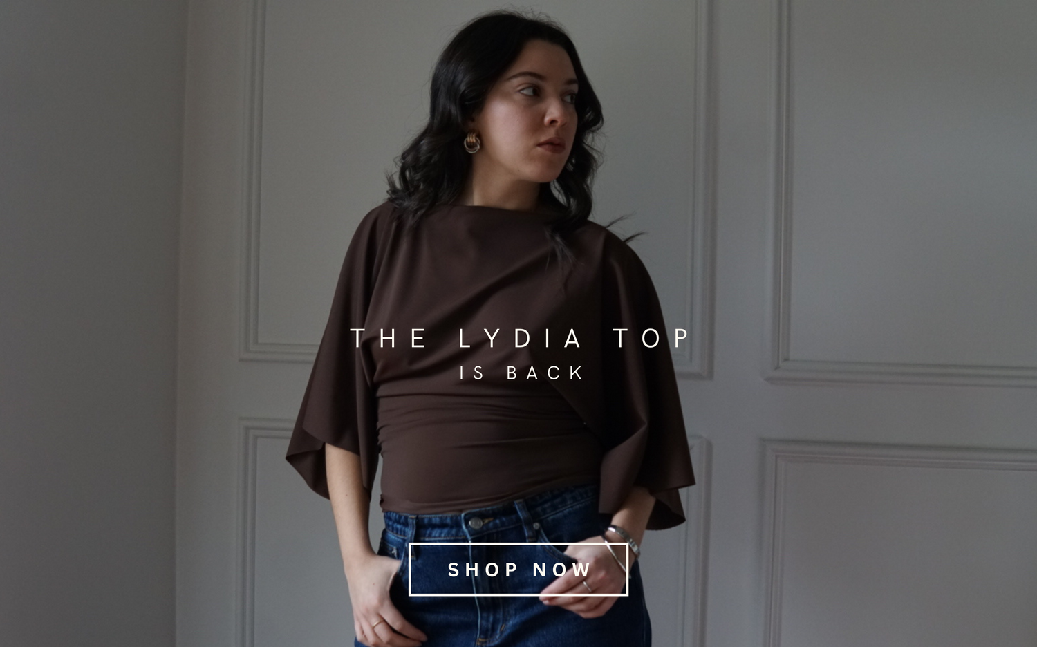Woman wearing a brown top with text overlay on a plain background